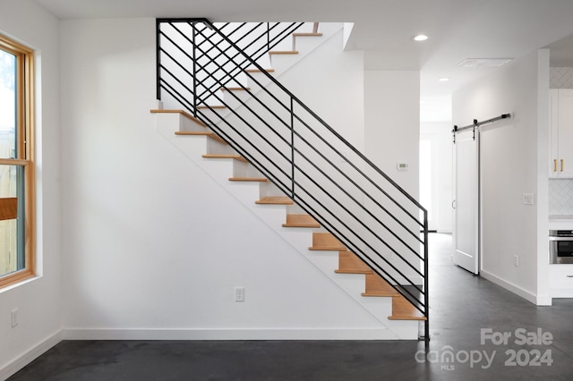 staircase with a barn door