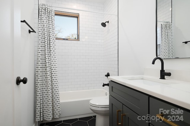 full bathroom featuring tile patterned flooring, vanity, toilet, and shower / tub combo with curtain