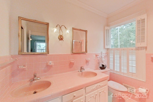 bathroom featuring toilet, vanity, walk in shower, and crown molding