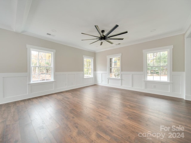 spare room featuring dark hardwood / wood-style floors, ceiling fan, and ornamental molding