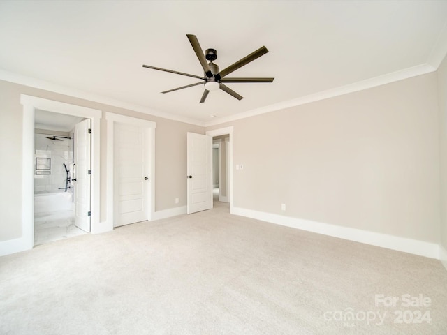 unfurnished bedroom with ceiling fan, carpet, and ornamental molding