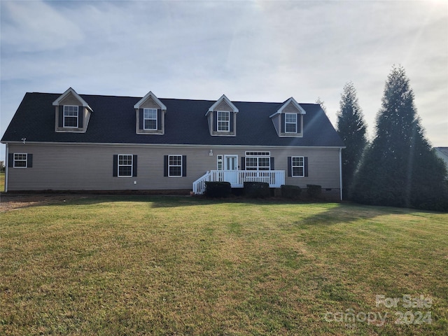 129 Burning Ln, Stony Point, NC 28678 - cape cod house featuring a front lawn and a wooden deck