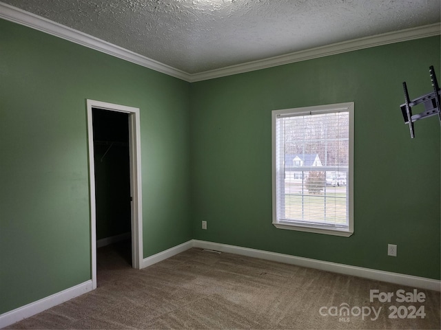 129 Burning Ln, Stony Point, NC 28678 - unfurnished bedroom with ornamental molding, a textured ceiling, carpet flooring, and baseboards