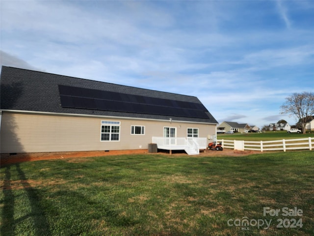 129 Burning Ln, Stony Point, NC 28678 - rear view of house featuring roof mounted solar panels, cooling unit, a deck, and crawl space