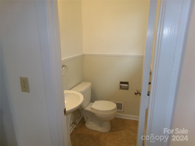 bathroom featuring toilet