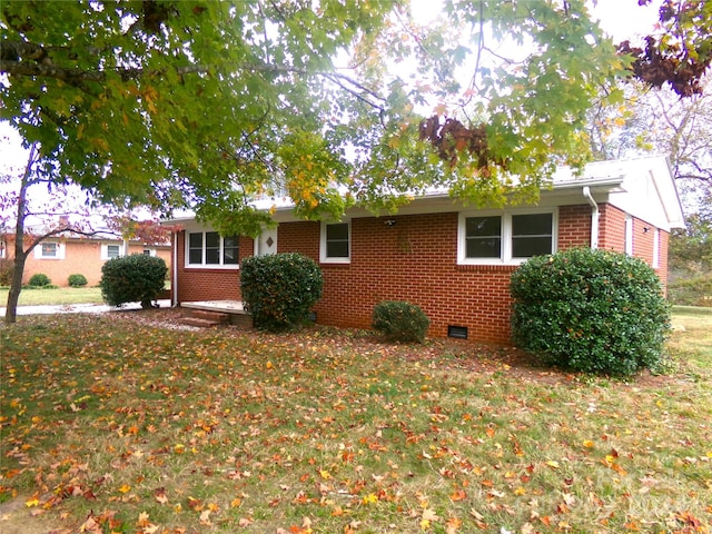 ranch-style house with a front lawn