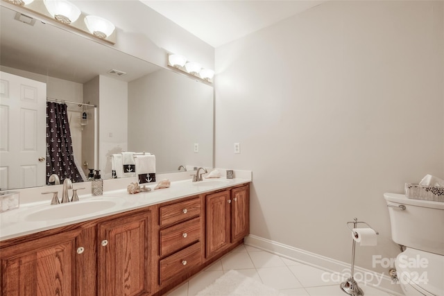 bathroom featuring tile patterned floors, a shower with curtain, vanity, and toilet