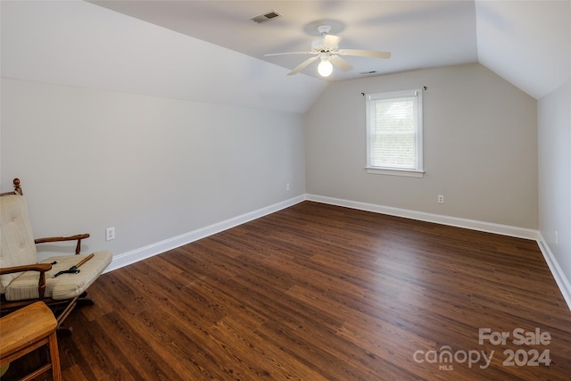 additional living space featuring ceiling fan, dark hardwood / wood-style flooring, and vaulted ceiling