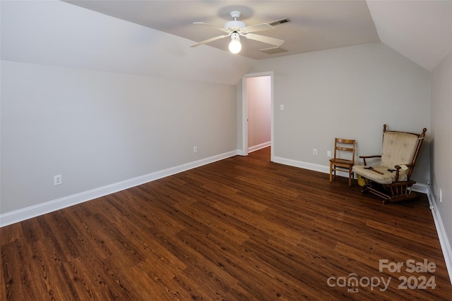 unfurnished room with ceiling fan, dark wood-type flooring, and vaulted ceiling