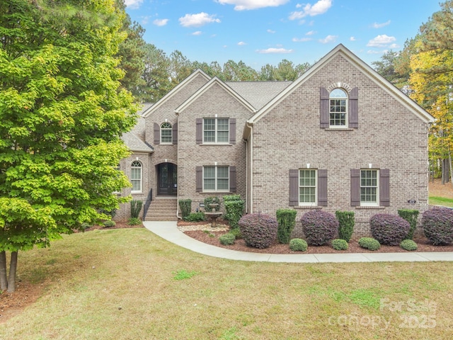 view of front of home with a front lawn