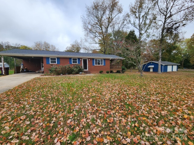 ranch-style home with a front lawn and a carport