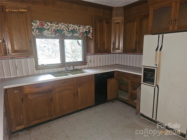 kitchen with sink, white refrigerator, and black dishwasher