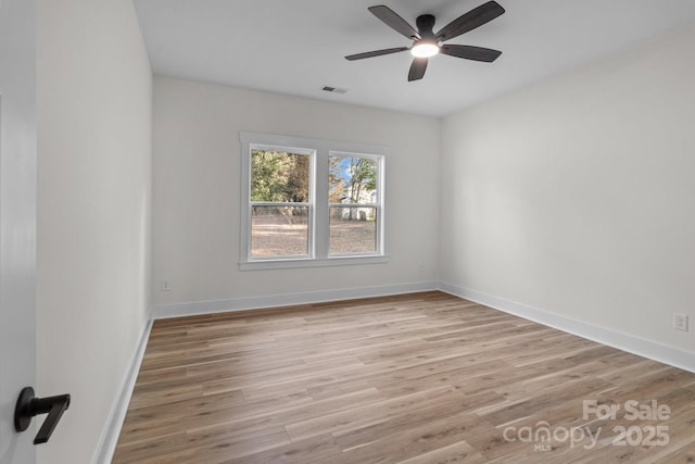 unfurnished room featuring light hardwood / wood-style flooring and ceiling fan