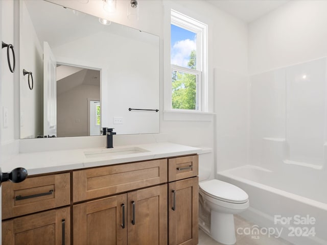 full bathroom with vanity, toilet, shower / bathing tub combination, and vaulted ceiling