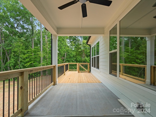 wooden deck with ceiling fan