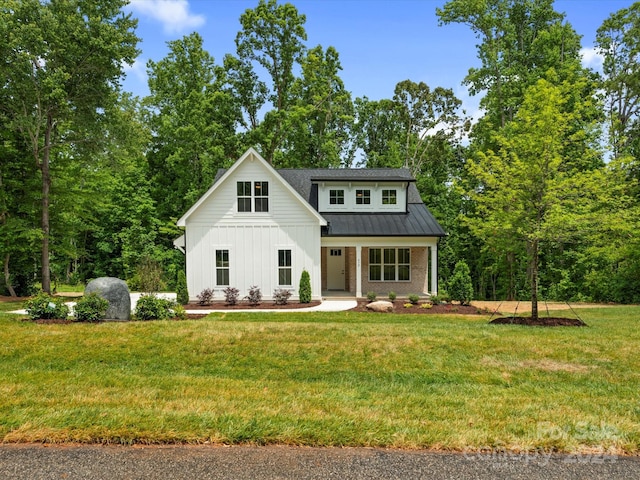 modern farmhouse with a front yard