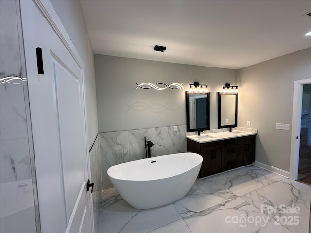 bathroom featuring vanity and a bathing tub