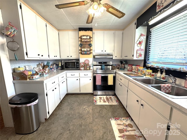 kitchen with sink, stainless steel appliances, white cabinets, and ceiling fan