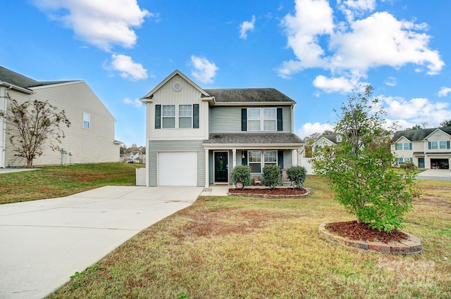 view of front of property featuring a front yard and a garage