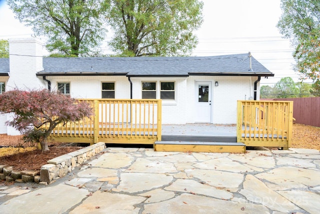 view of front of property with a patio and a deck