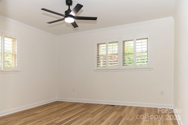 unfurnished room with hardwood / wood-style flooring, ceiling fan, a healthy amount of sunlight, and ornamental molding