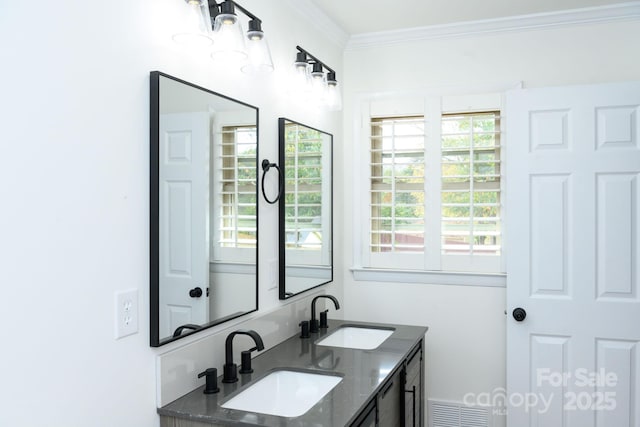 bathroom with vanity and crown molding