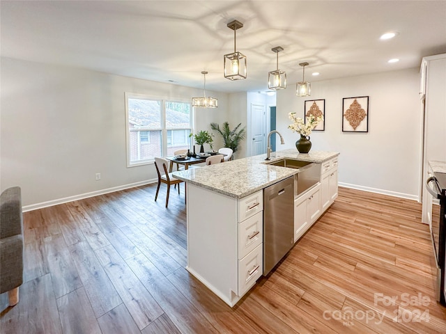 kitchen with light hardwood / wood-style floors, dishwasher, white cabinets, an island with sink, and pendant lighting