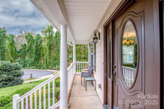 view of exterior entry featuring a porch