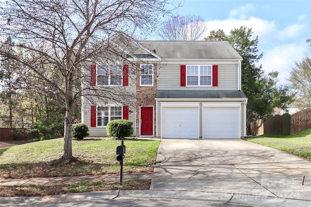 view of front of house featuring a garage and a front yard