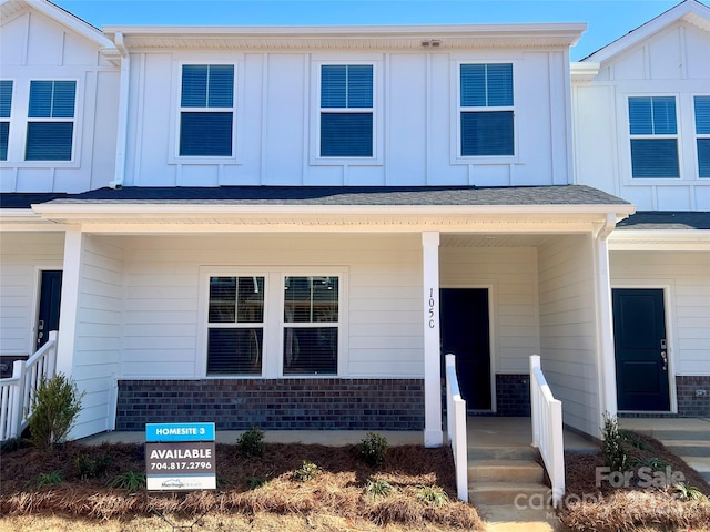 multi unit property featuring a porch