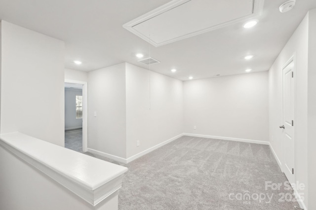 spare room with light colored carpet