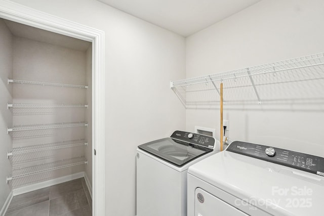 clothes washing area with washing machine and dryer