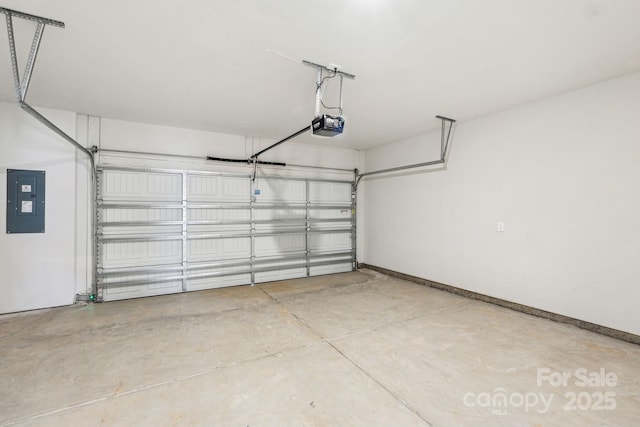 garage with a garage door opener and electric panel