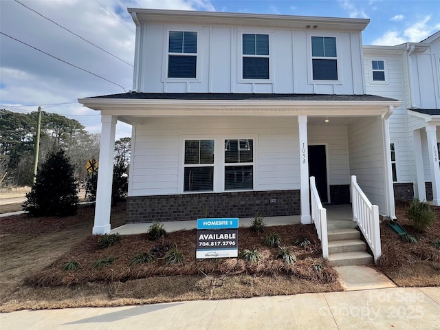 multi unit property featuring a porch