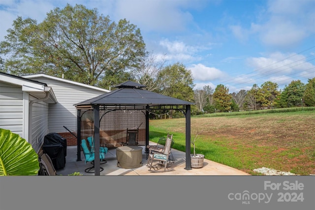 view of patio / terrace with area for grilling and a gazebo