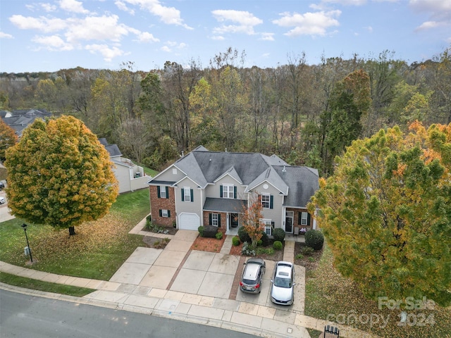 view of front facade with a front lawn and a garage