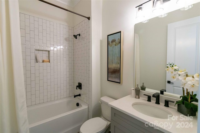 full bathroom with shower / tub combo with curtain, vanity, and toilet