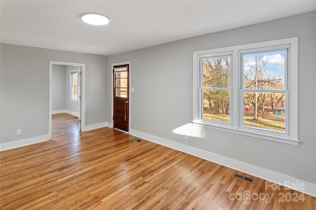 spare room with light wood-type flooring