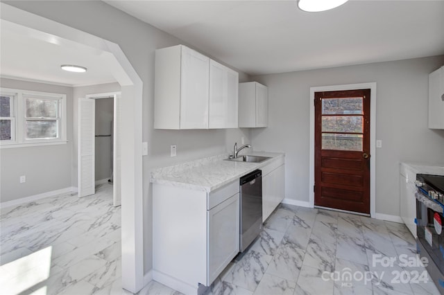 kitchen with white cabinets, sink, and stainless steel appliances