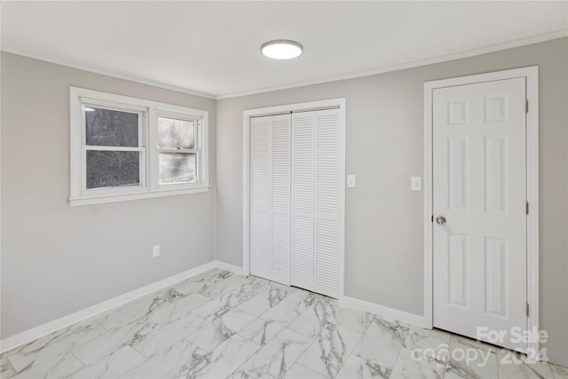 unfurnished bedroom with crown molding