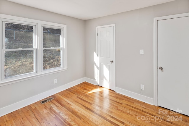 empty room featuring hardwood / wood-style floors