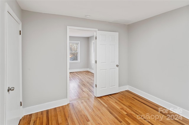 unfurnished bedroom featuring light wood-type flooring