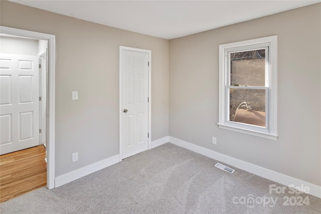 unfurnished bedroom with carpet