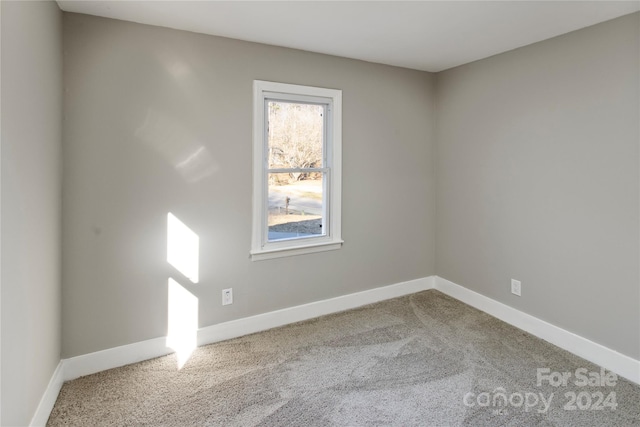 empty room with carpet flooring