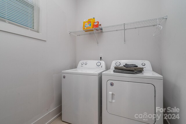 washroom featuring washer and clothes dryer