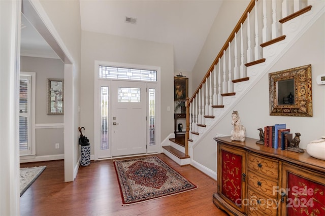 entryway with dark hardwood / wood-style flooring