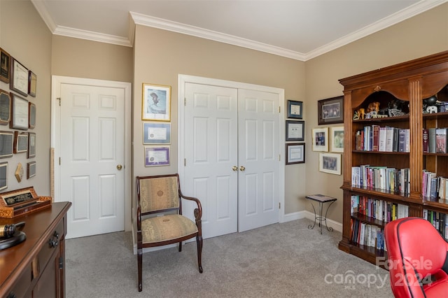 sitting room featuring crown molding and light carpet