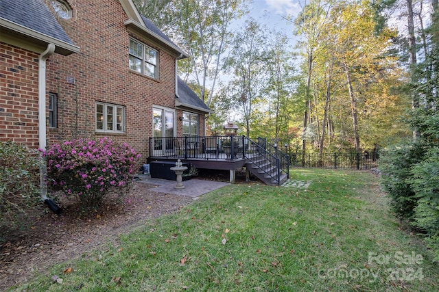 view of yard with a wooden deck