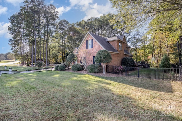 view of property exterior featuring a lawn