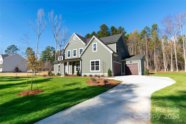 front facade featuring a porch, a garage, and a front lawn